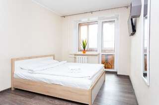 Апартаменты Apartments on Nemiga Минск Четырехместный номер с балконом-3